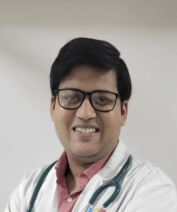 Dr. Abhinav Banerjee wearing a white coat and stethoscope